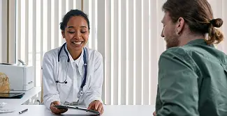 A doctor talking to her patient.