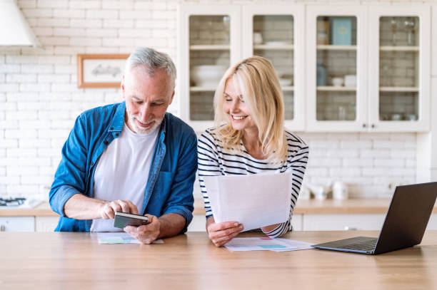 Couple Reviewing Documents Together at Home