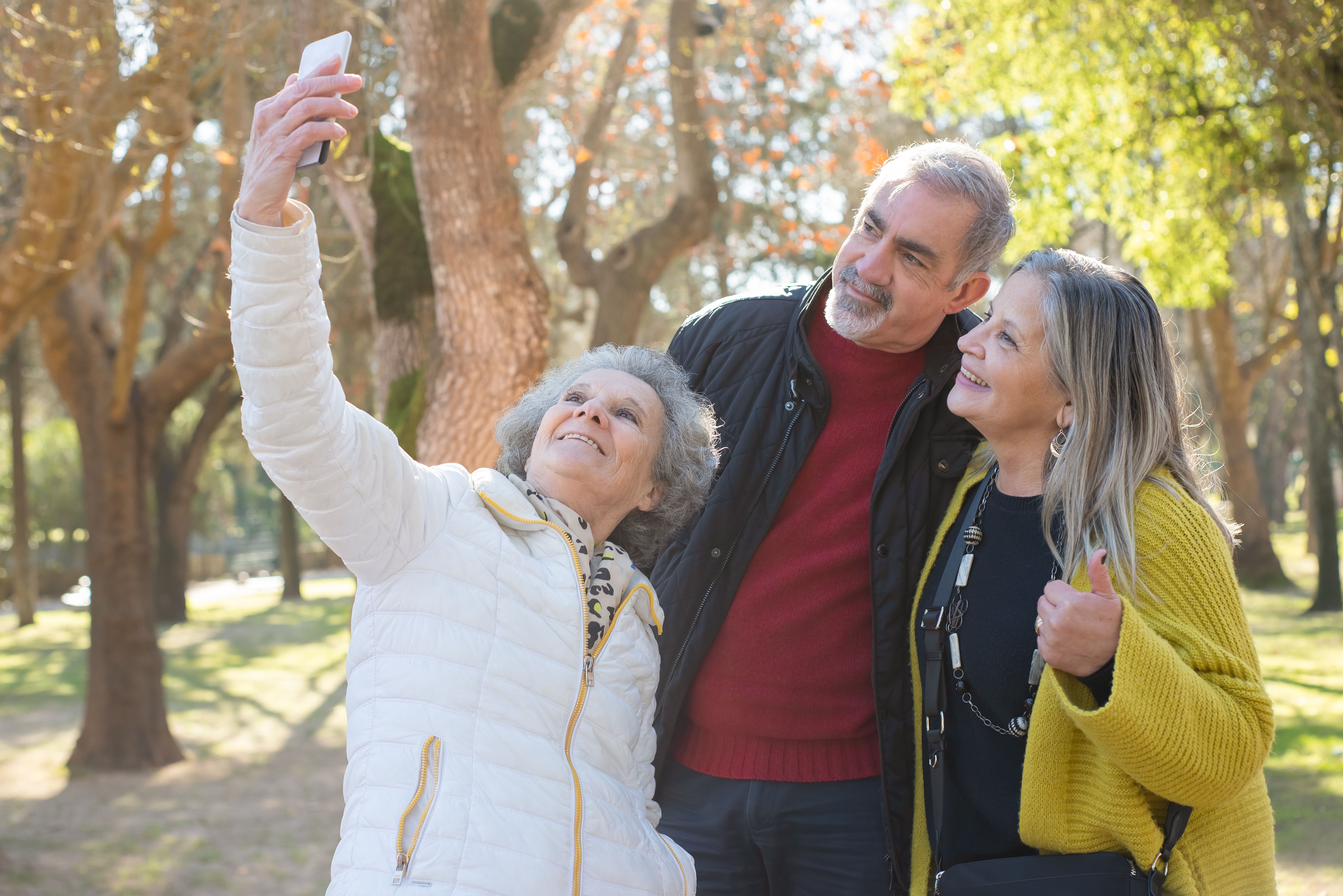 3 retired people taking a selfie