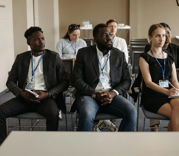 People attending a workshop and listening attentively